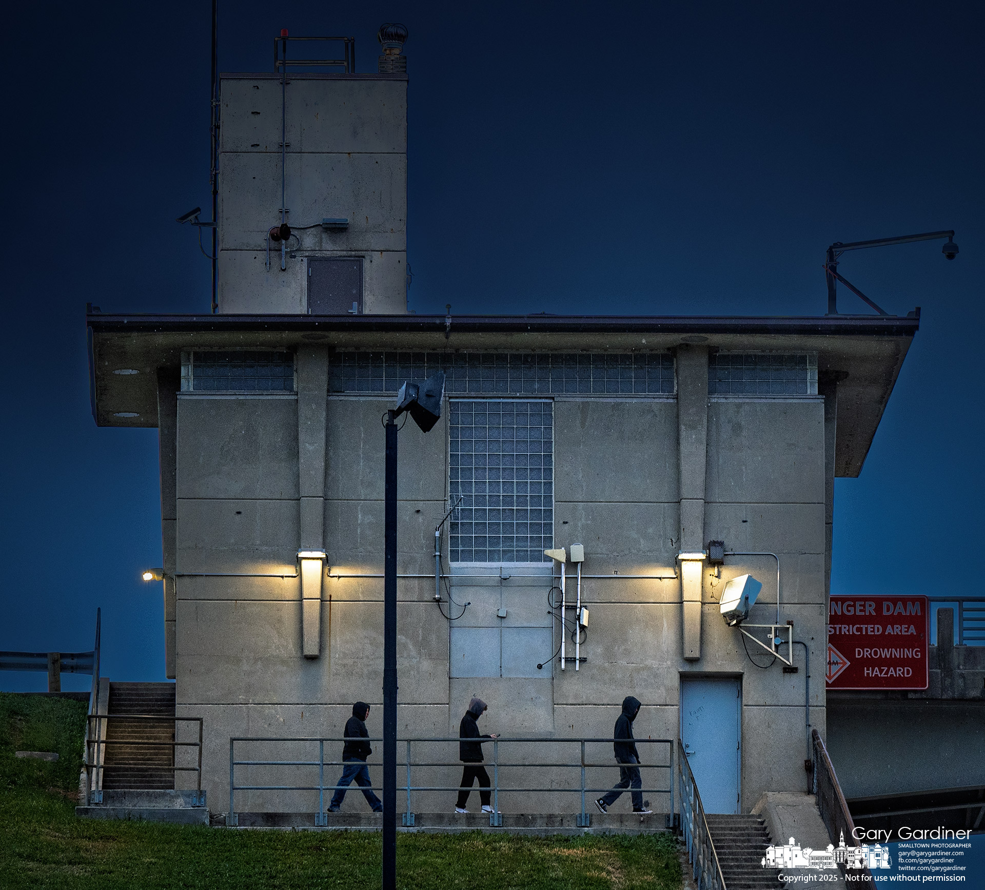 Shrouded in wind, cold, and evening darkness, walkers make their way along the stairs at Hoover Reservoir on Thanksgiving night. My Final Photo for November 27, 2025.
