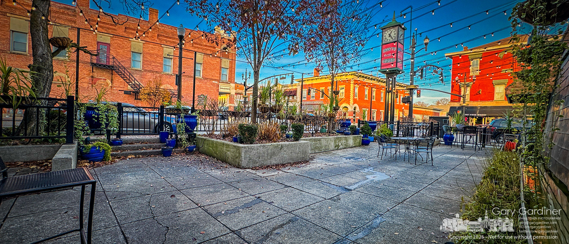 Despite the mild weather, most of the outdoor seating at Jimmy V's in Uptown has been cleared, and the waterfall is turned off as a sign of the upcoming winter. My Final Photo for November 19, 2925.