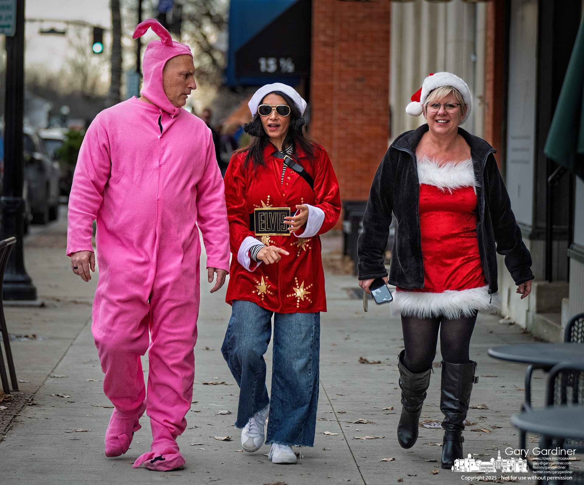Dressed as Ralphie in pink bunny pajamas, Marc Glasgow joins a Christmas-themed bar crawl in Uptown Westerville the weekend before Christmas. My Final Photo for December 20, 2025.