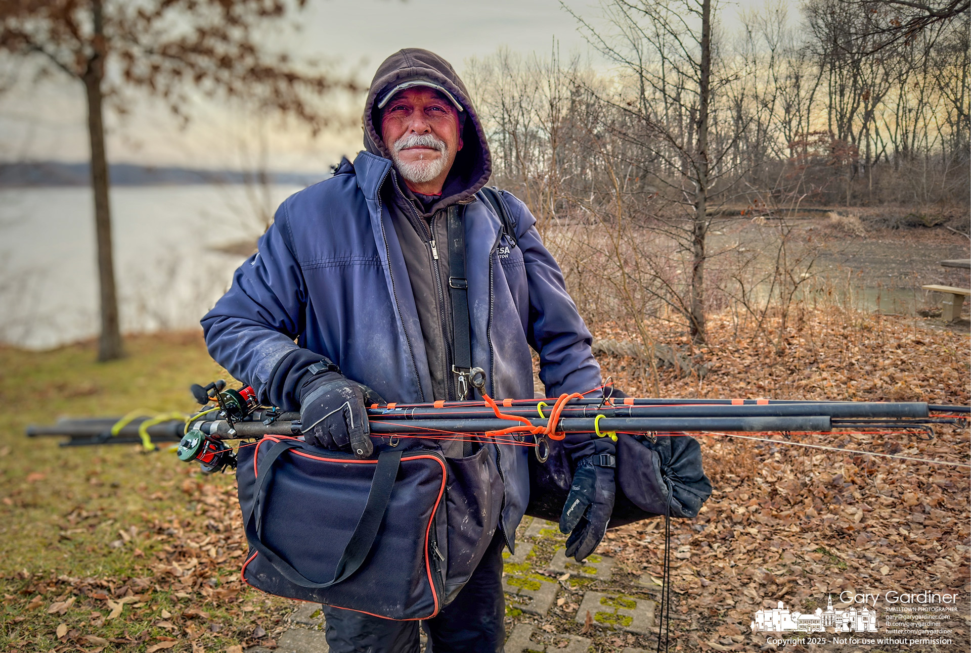 A fisherman walks empty-handed to his car at Red Bank Park after spending part of Christmas afternoon casting for blue catfish without any luck. My Final Photo for December 25, 2025.