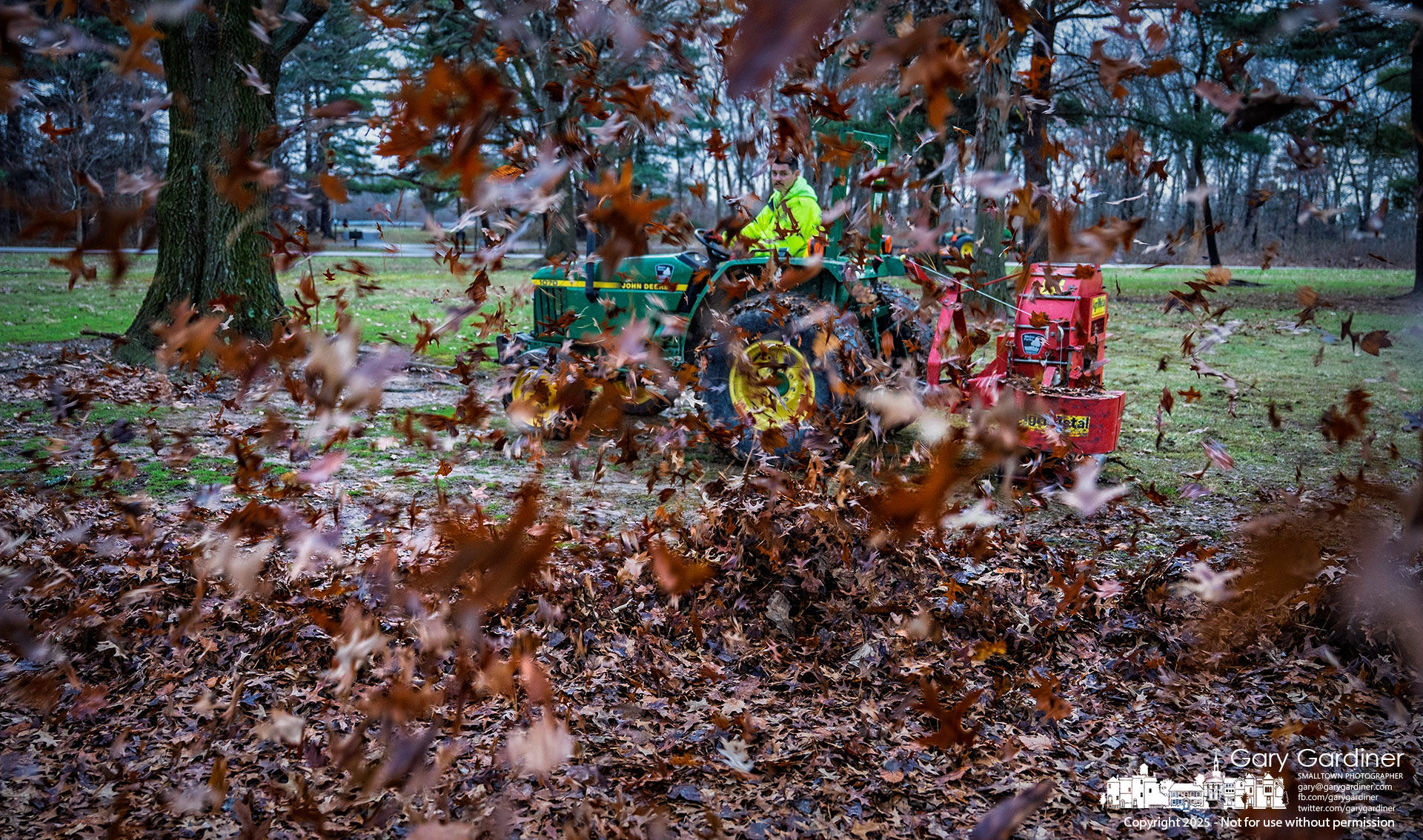 A slurry of wet leaves is thrown across Sharon Woods as the grounds crew clears the fields after rain and snow dampened the deciduous droppings. My Final Photo for December 23, 2025.