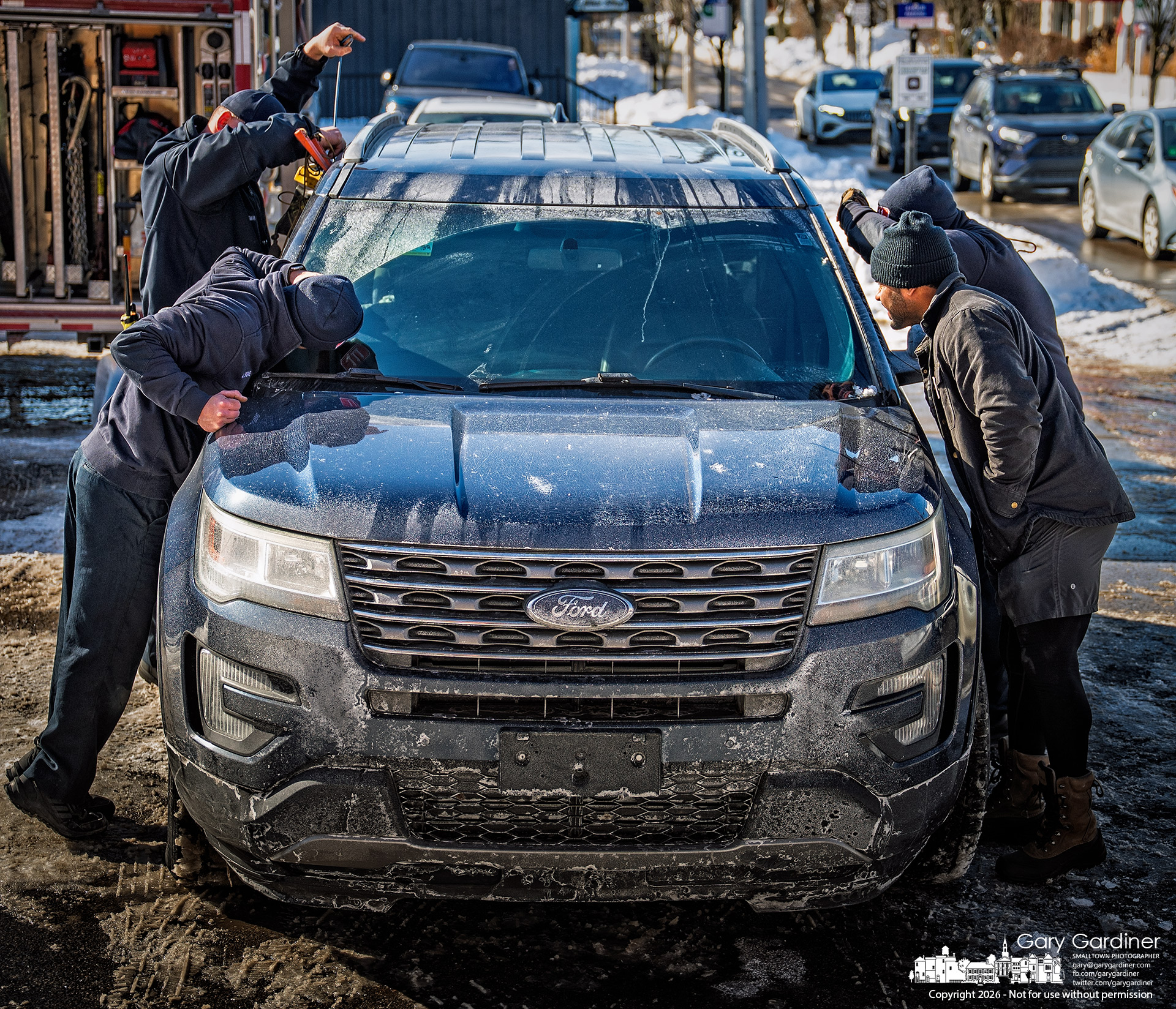 Westerville firefighters help a father retrieve his infant son after the car was accidentally locked with the child inside. (My Final Photo for January 30, 2026.)