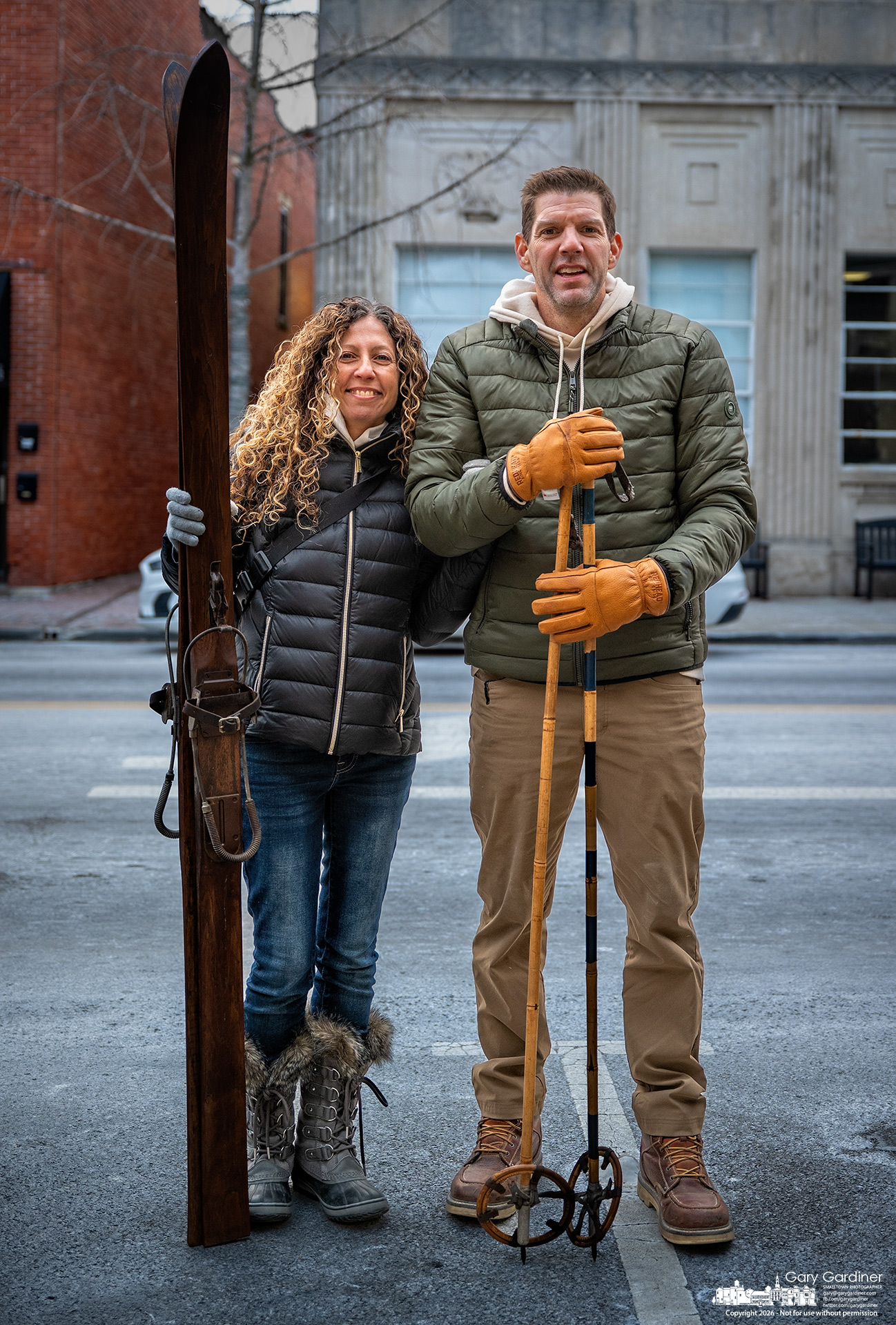 Jules and Kyle Whisler pose with the antique skis and poles they bought Saturday, several hours before a forecast predicting as much as 15 inches os snow in some parts of Ohio. Although both are avid skiers, the set is intended for decoration in a room in their home. (My Final Photo for January 24, 2026)