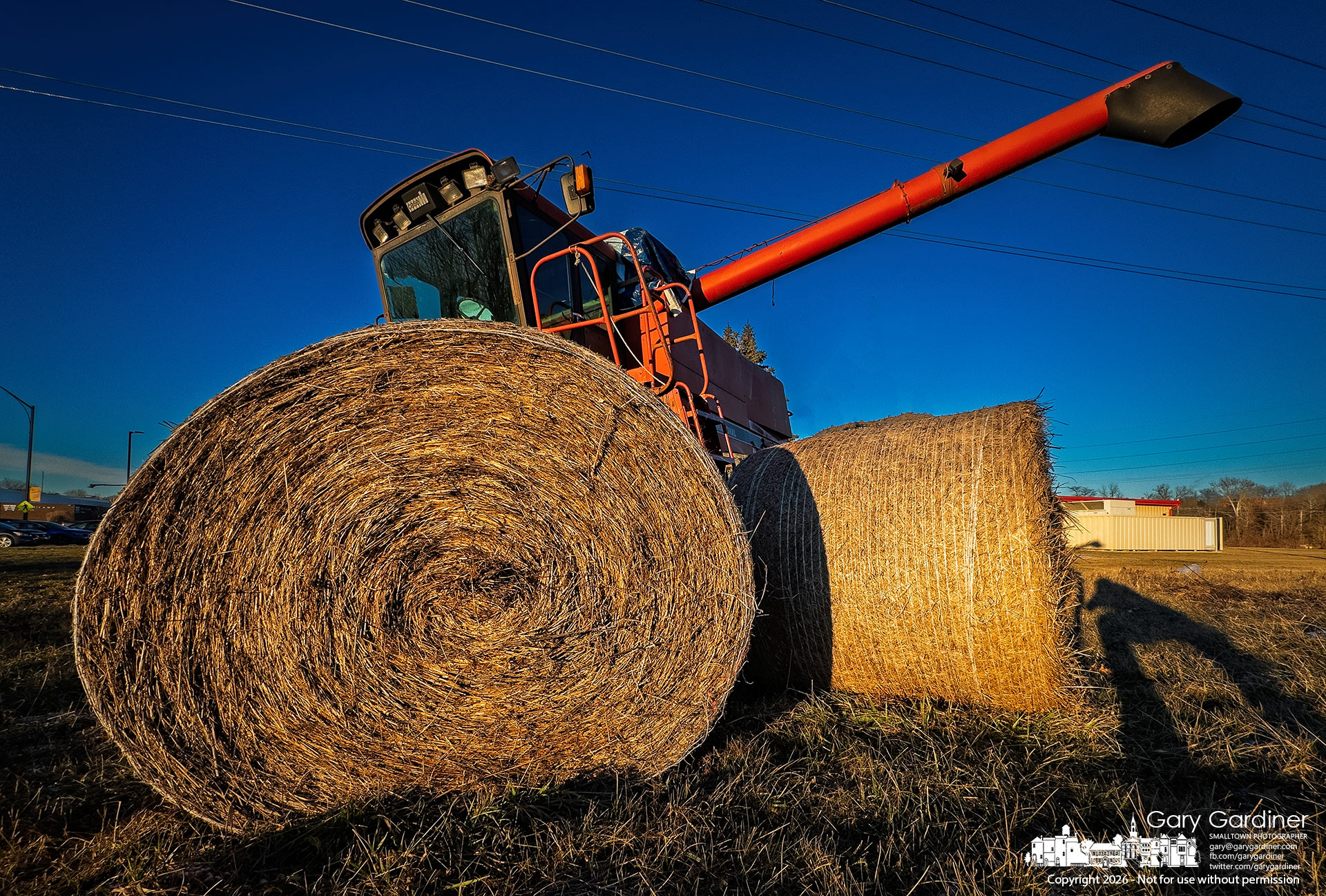 The late afternoon winter sun casts a deceptively warm glow over hay bales and an idle combine at the Braun Farm, even as temperatures drop into the teens at night and struggle to reach the mid-20s during the day. My Final Photo for January 15, 2026.
