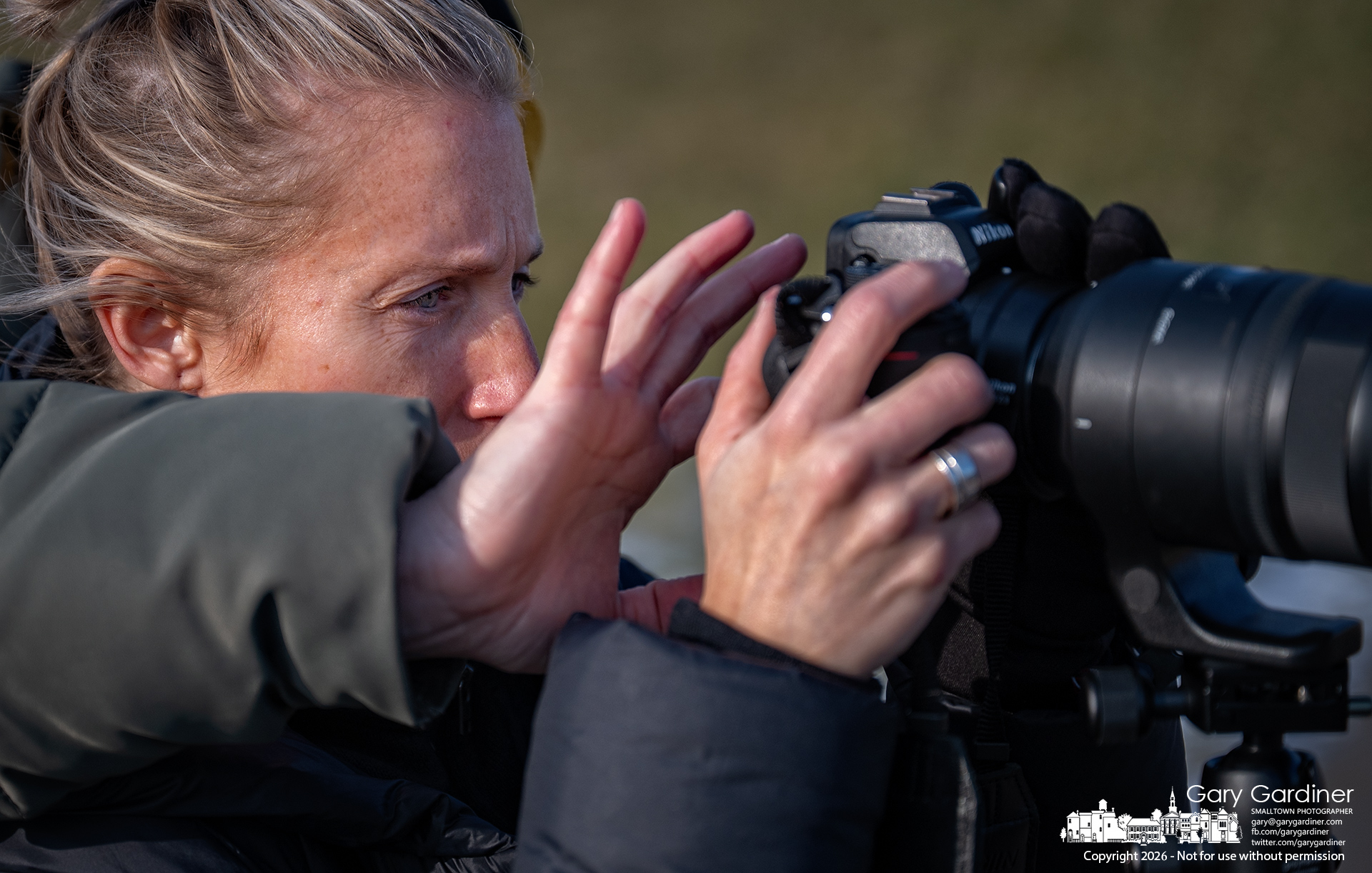 While scanning for birds below Hoover Dam, a companion reaches around to help adjust the camera, producing the odd illusion of a birdwatcher with two right hands. My Final Photo for January 4, 2026.