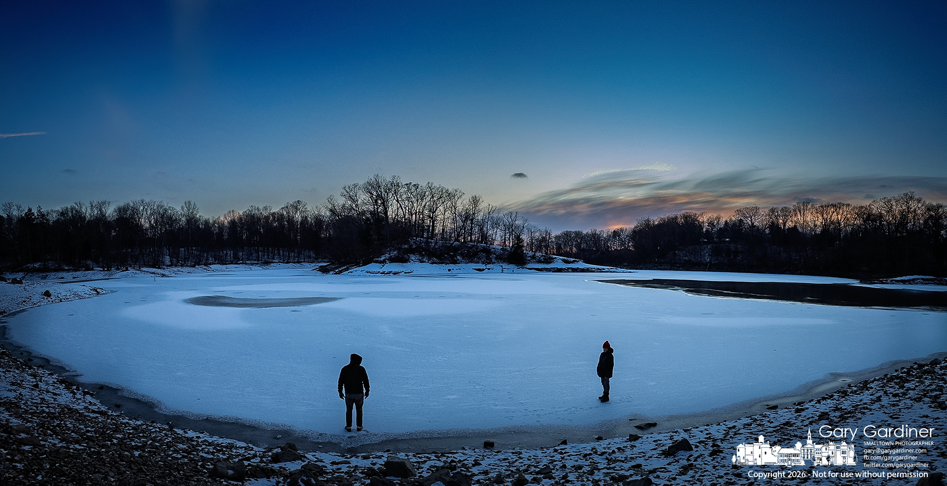 Father and son test the thickness of the ice on the lagoon at Twin Bridges on Hoover Reservoir. My Final Photo for January 18, 2026.