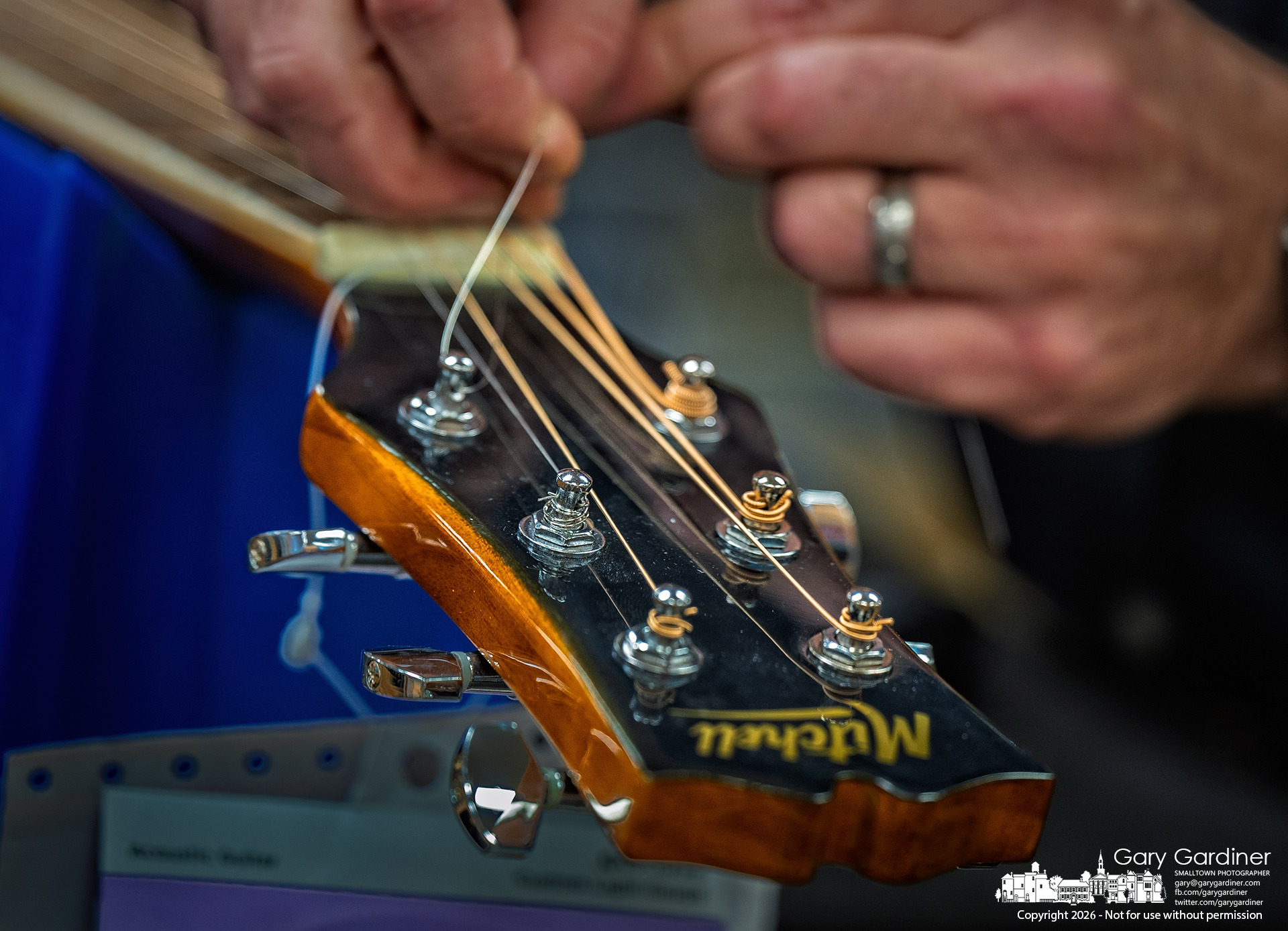 The last string is tightened on a freshly restrung guitar on Wednesday afternoon at Music & Arts in Uptown. My Final Photo for January 7, 2026.