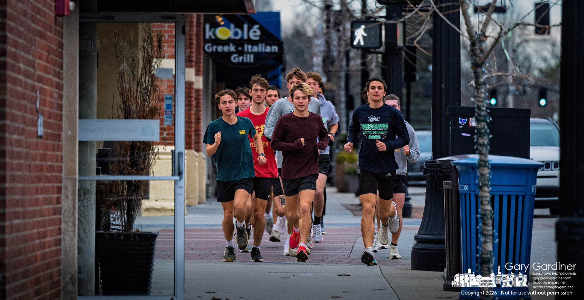 A cross-country team crosses College Avenue on a training run late Tuesday afternoon. My Final Photo for January 13, 2026.