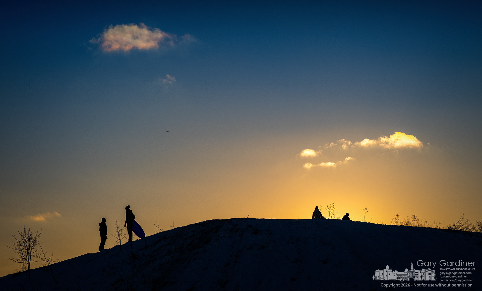 Arctic Westerville - Sledders and snowboarders gather atop the snow-covered hill at Alum Creek Park South late Wednesday afternoon, where single-digit temperatures have turned the packed snow into ice, making for faster, more thrilling rides. (My Final Photo for January 28, 2026.)