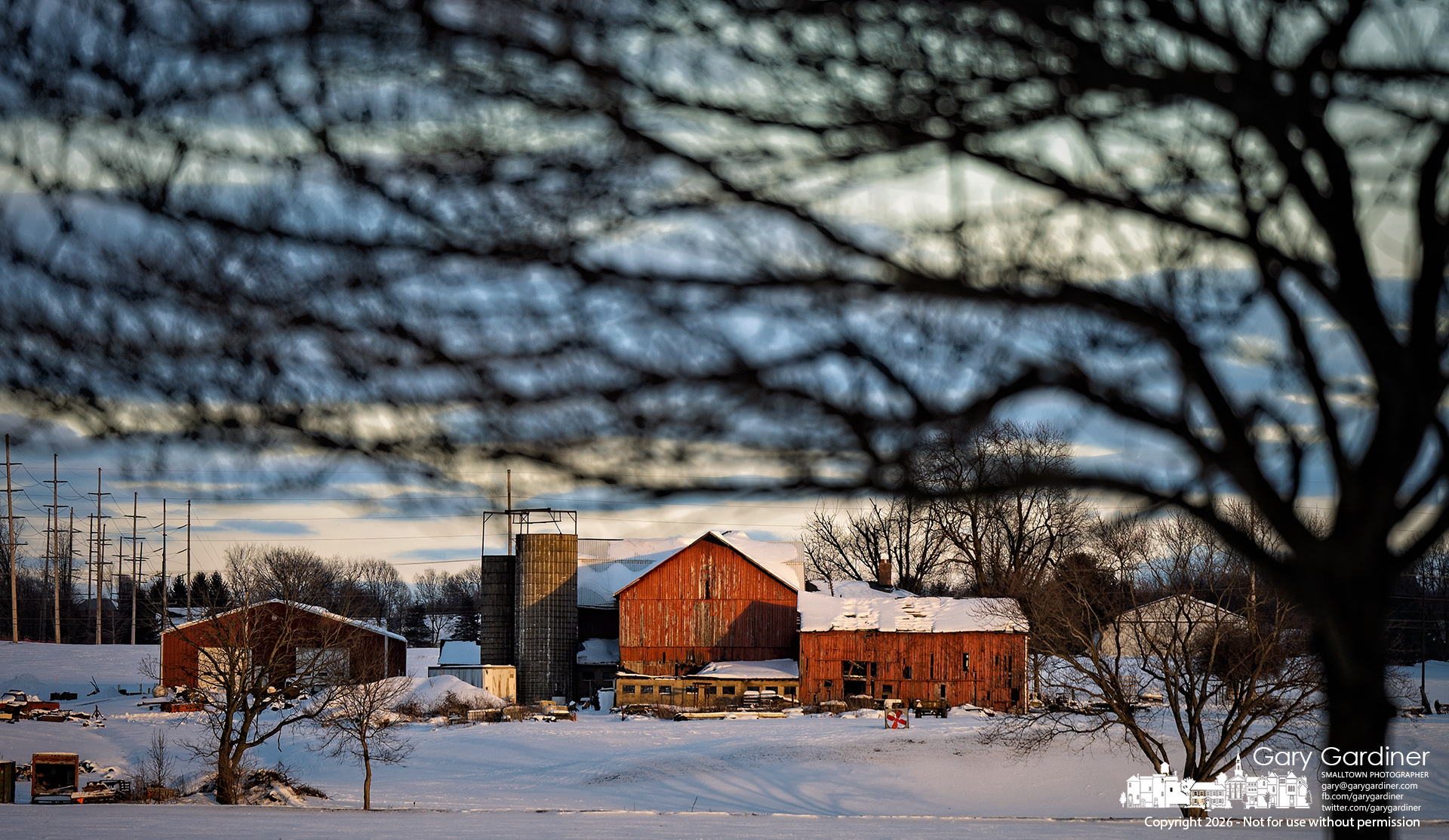 Late-afternoon winter light falls on snow-covered fields and the barns at Yarnell Farm. (My Final Photo for January 29, 2026)