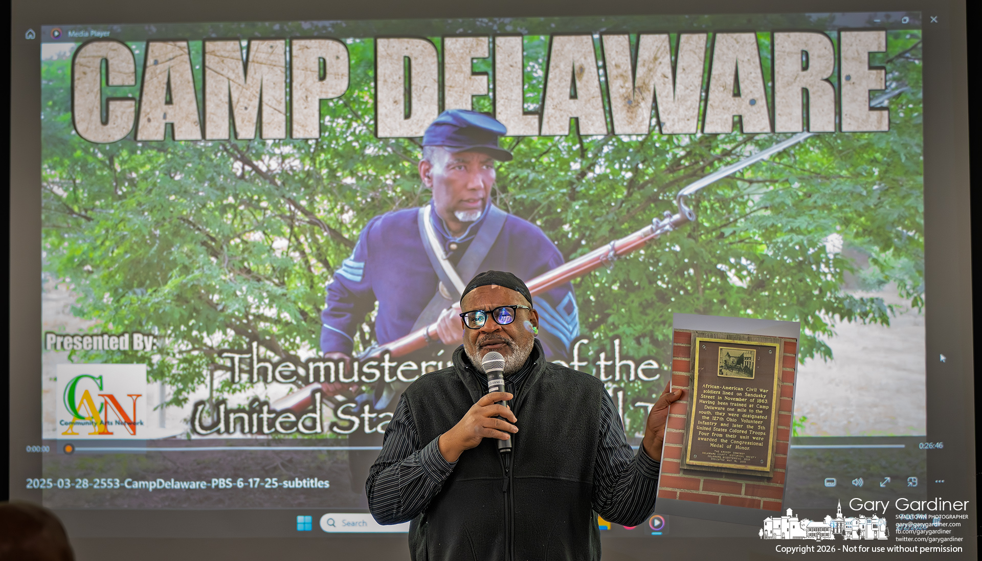 Filmmaker Mark Butler displays a photo of a historical marker in Delaware that inspired a stage production and a film about "Camp Delaware," where Black Ohio Civil War soldiers were trained. (My Final Photo for February 2, 2026)