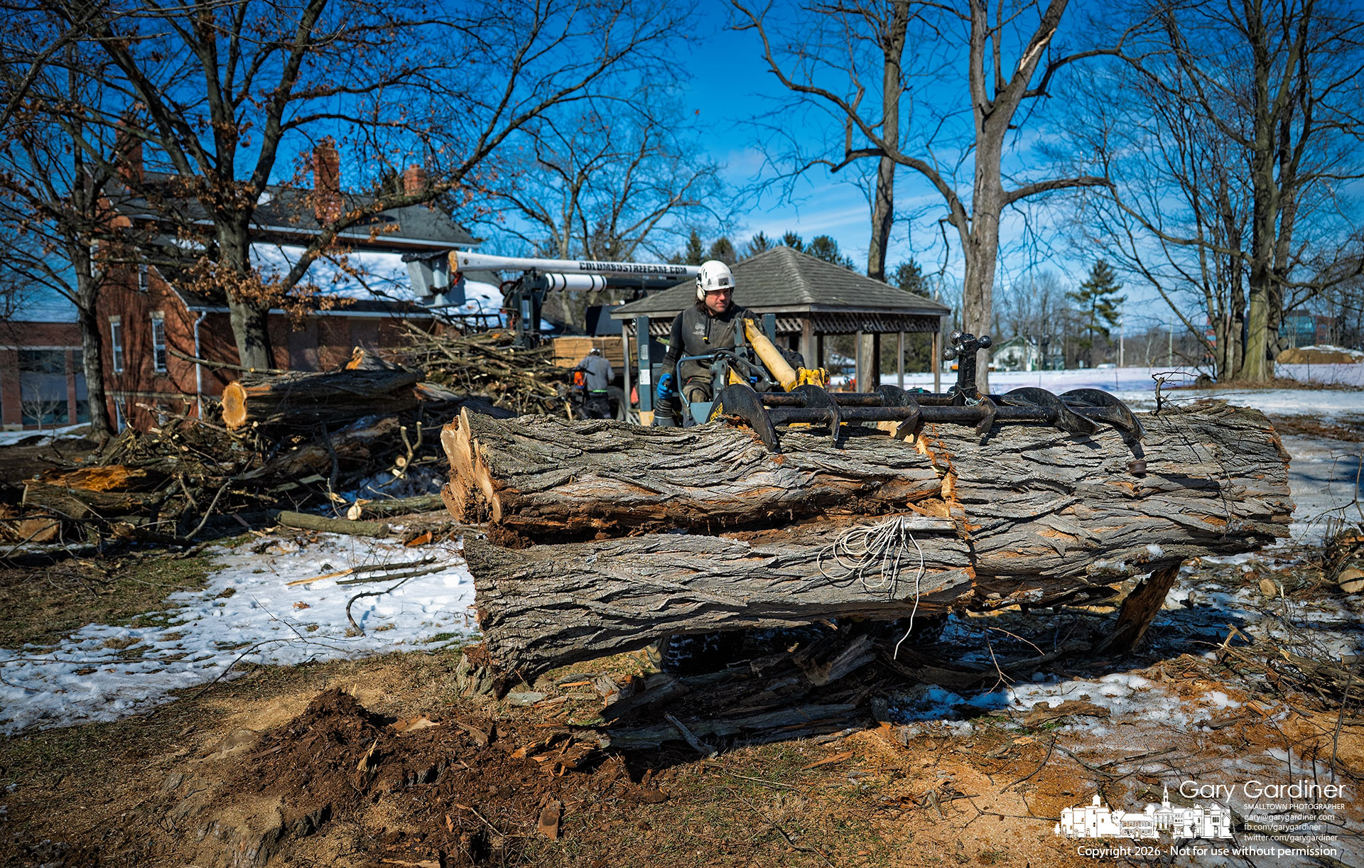 A tree removal company hauls away debris from five black locust trees cut down behind the Sharp House on Africa Road. (My Final Photo for February 12, 2026)