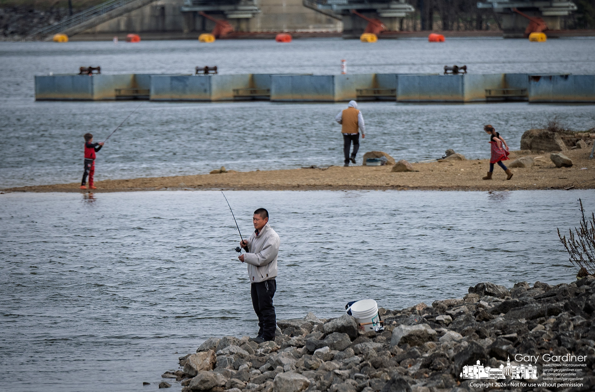 Families and fishermen share the shoreline at Hoover Reservoir on a warm winter afternoon. (My Final Photo for March 15, 2026)