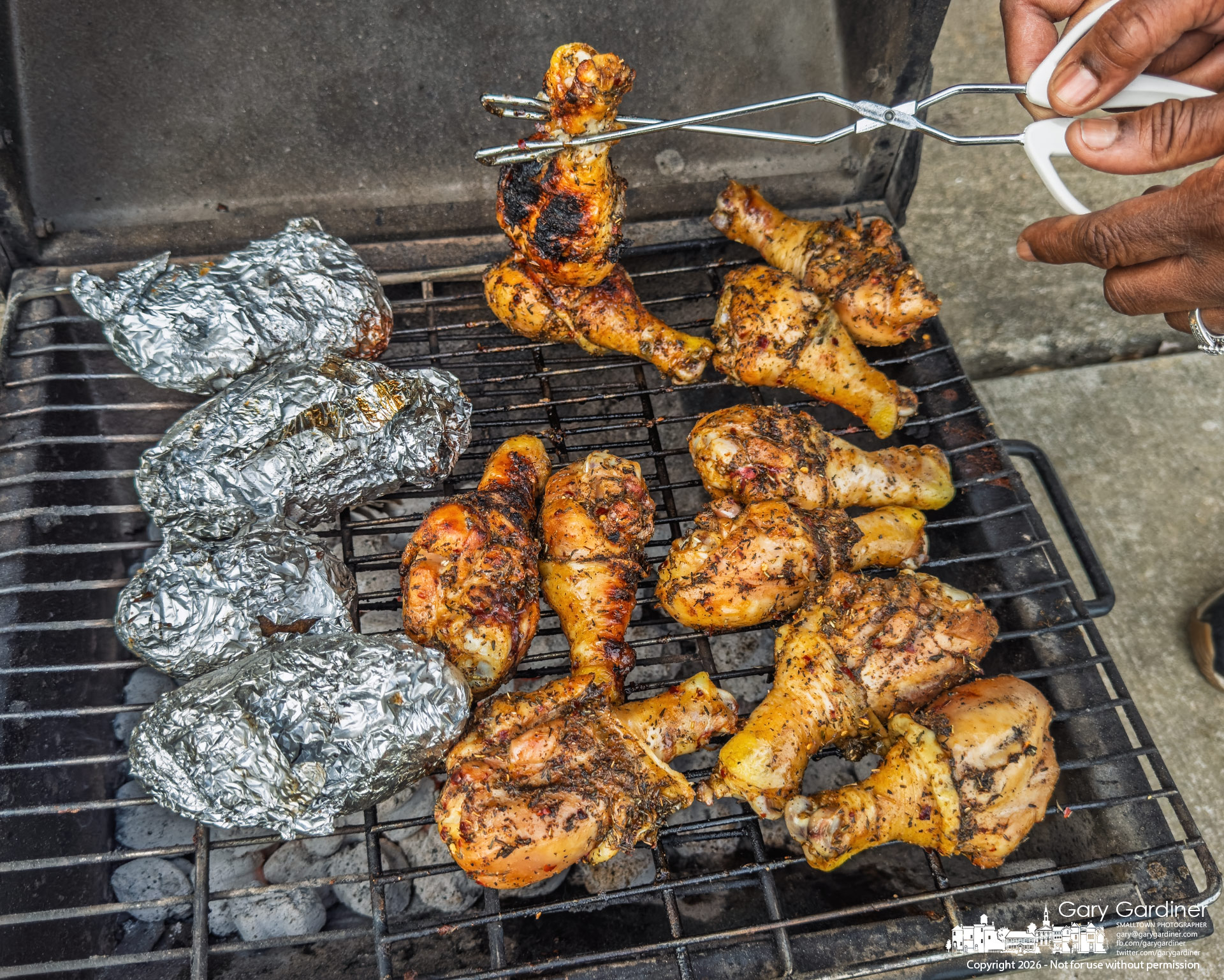 Grilled chicken wings and potatoes await the rest of a family fishing along the shoreline at Red Bank Park at Hoover. (My Final Photo for March 22, 2026)