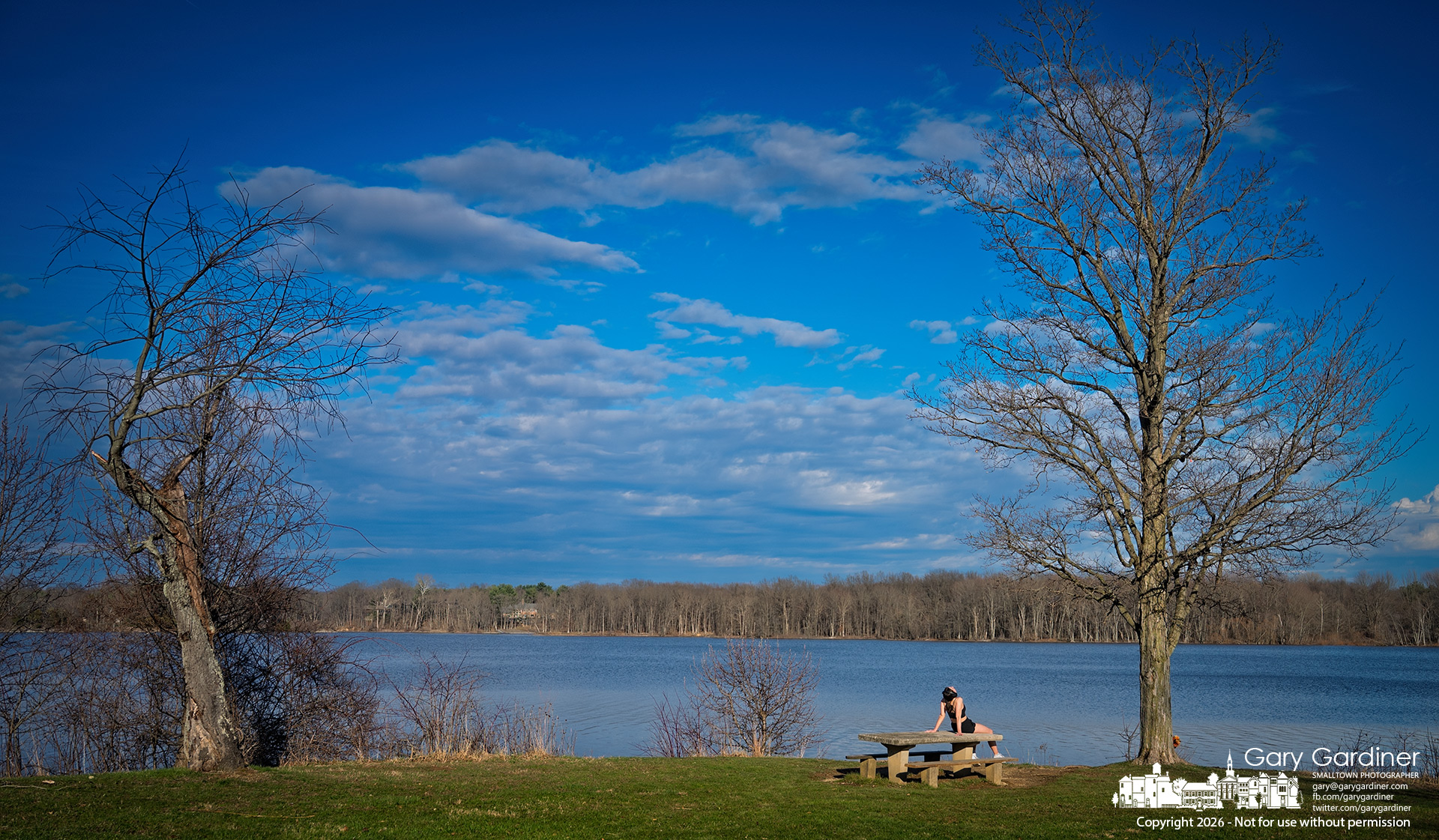A runner pauses at Red Bank Park on Hoover to enjoy the warmth of the late afternoon sun after a week of typical winter weather. (My Final Photo for March 19, 2026)