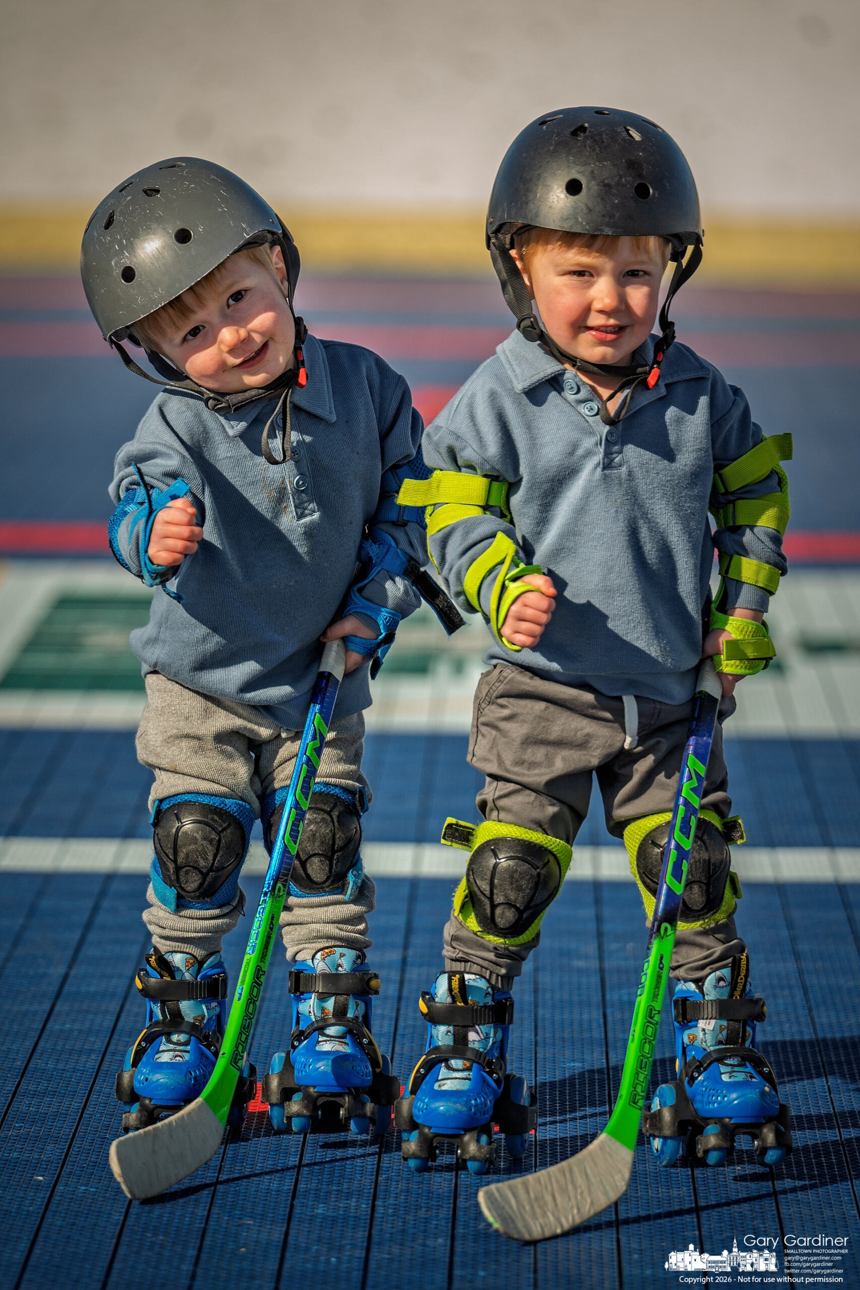 Four-year-old twins Zayden and Zaddock pose for a quick photo before beginning a game of hockey with their father at Thomas James Knox Memorial Roller Hockey Rink. (My Final Photo for March 1, 2026)