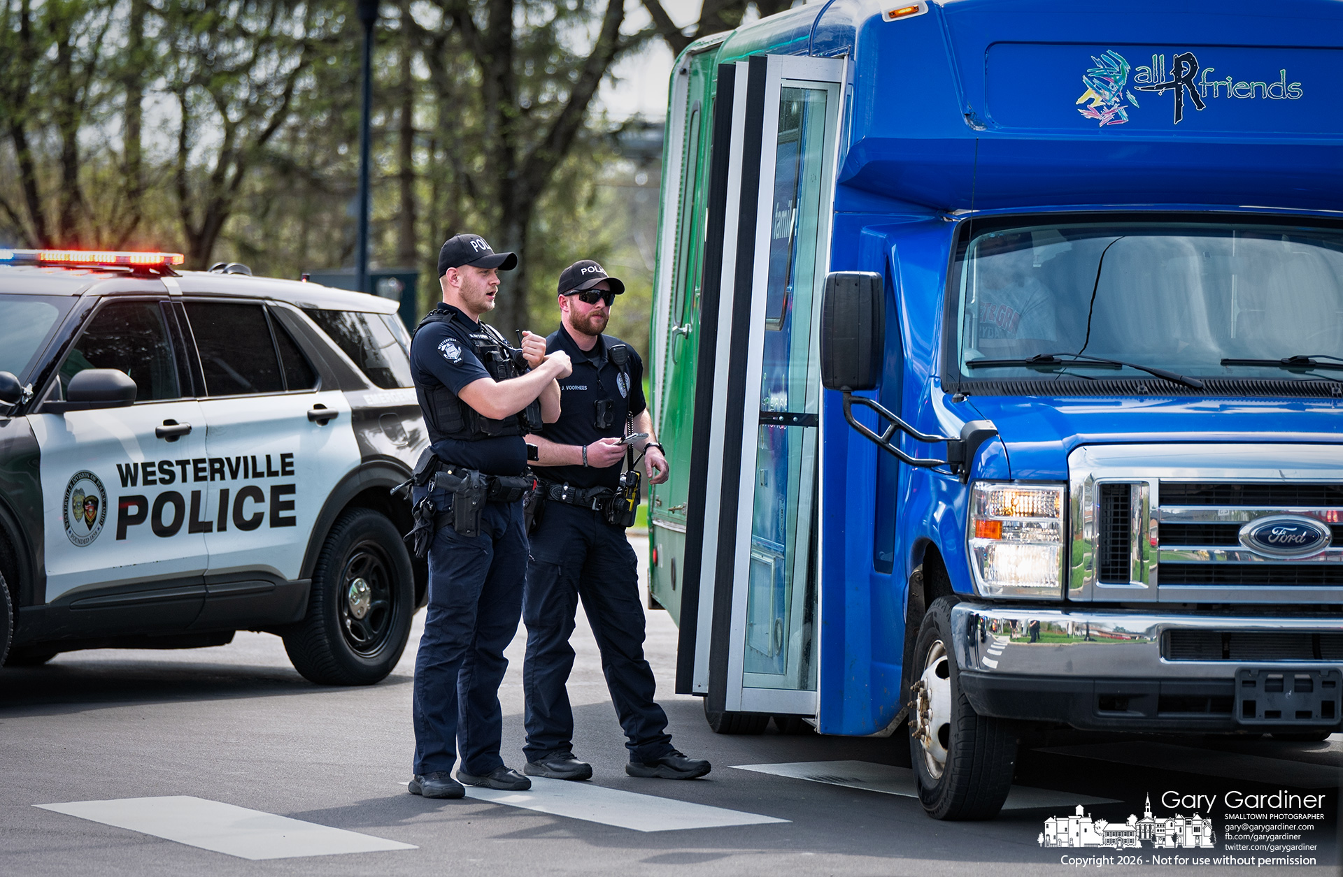 Westerville Police investigate a crash Thursday in which a school crossing guard was struck by a private school bus at Spring and East Walnut. (My Final Photo for April 9, 2026, by Gary Gardiner)