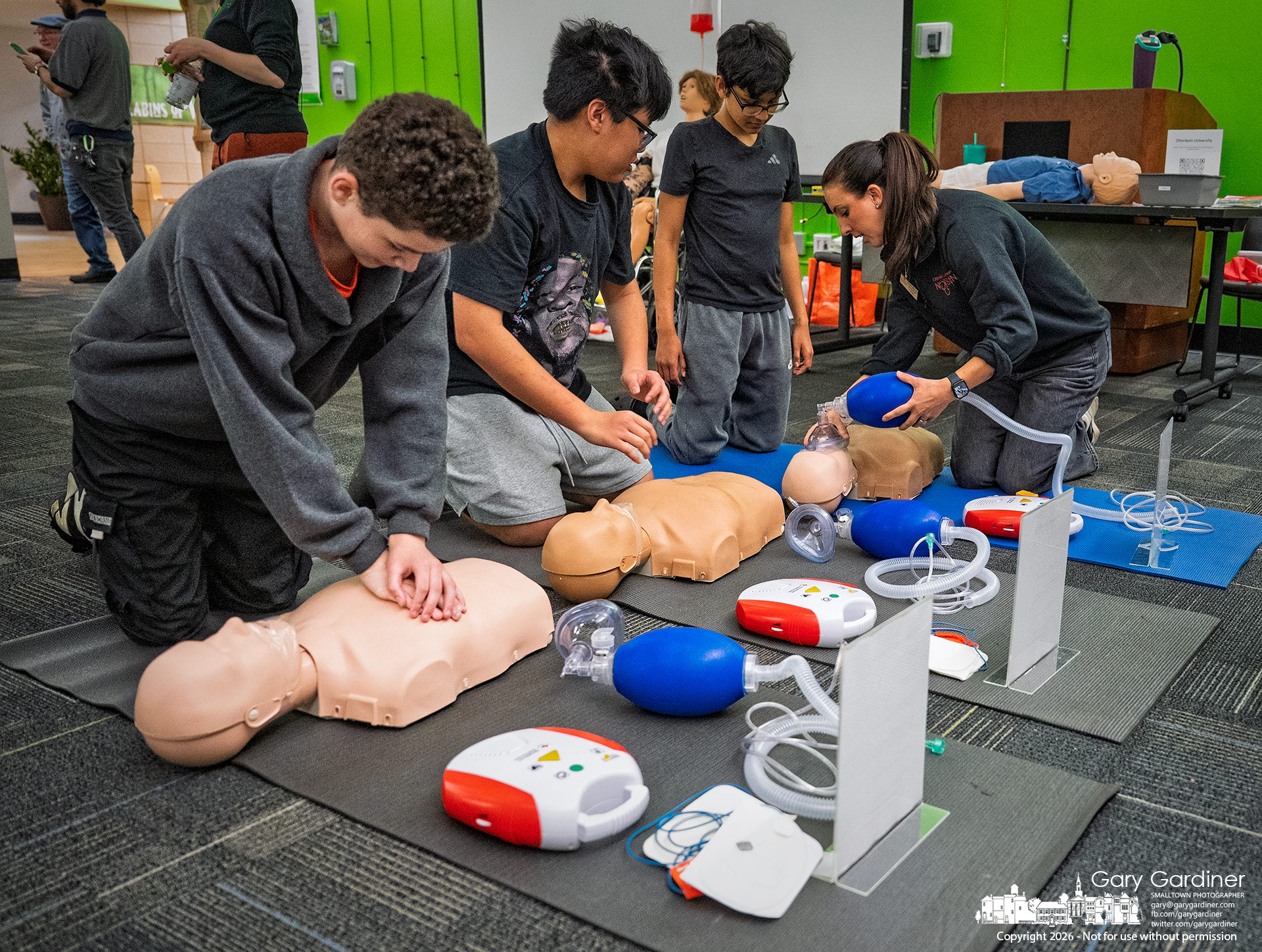 Students practice CPR and emergency airway procedures on training mannequins during the COSI Science Festival biomedical engineering program at the Westerville Public Library. (My Final Photo for April 29, 2026, by Gary Gardiner)