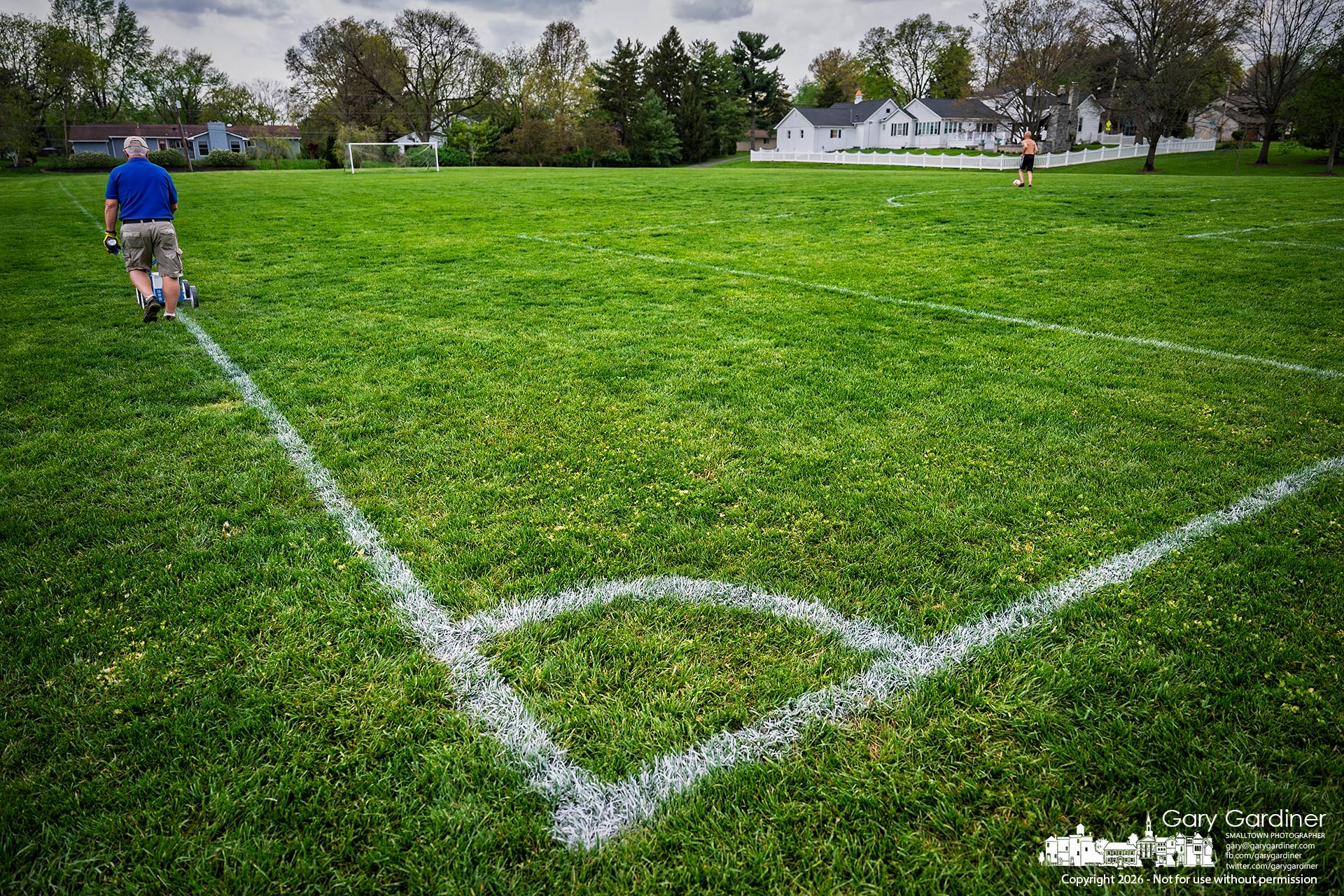 A soccer field at Highlands gets a fresh coat of stripes before midweek practices Wednesday afternoon. (My Final Photo for April 15, 2026)