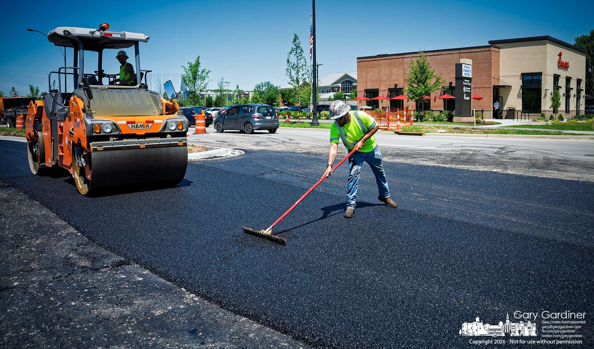 The finishing coat of asphalt is laid in the new intersection on Polari Parkway leading to the Chick-fil-A and the empty field where Aldi plans to build a new store. (My Final Photo for May 28, 2026)