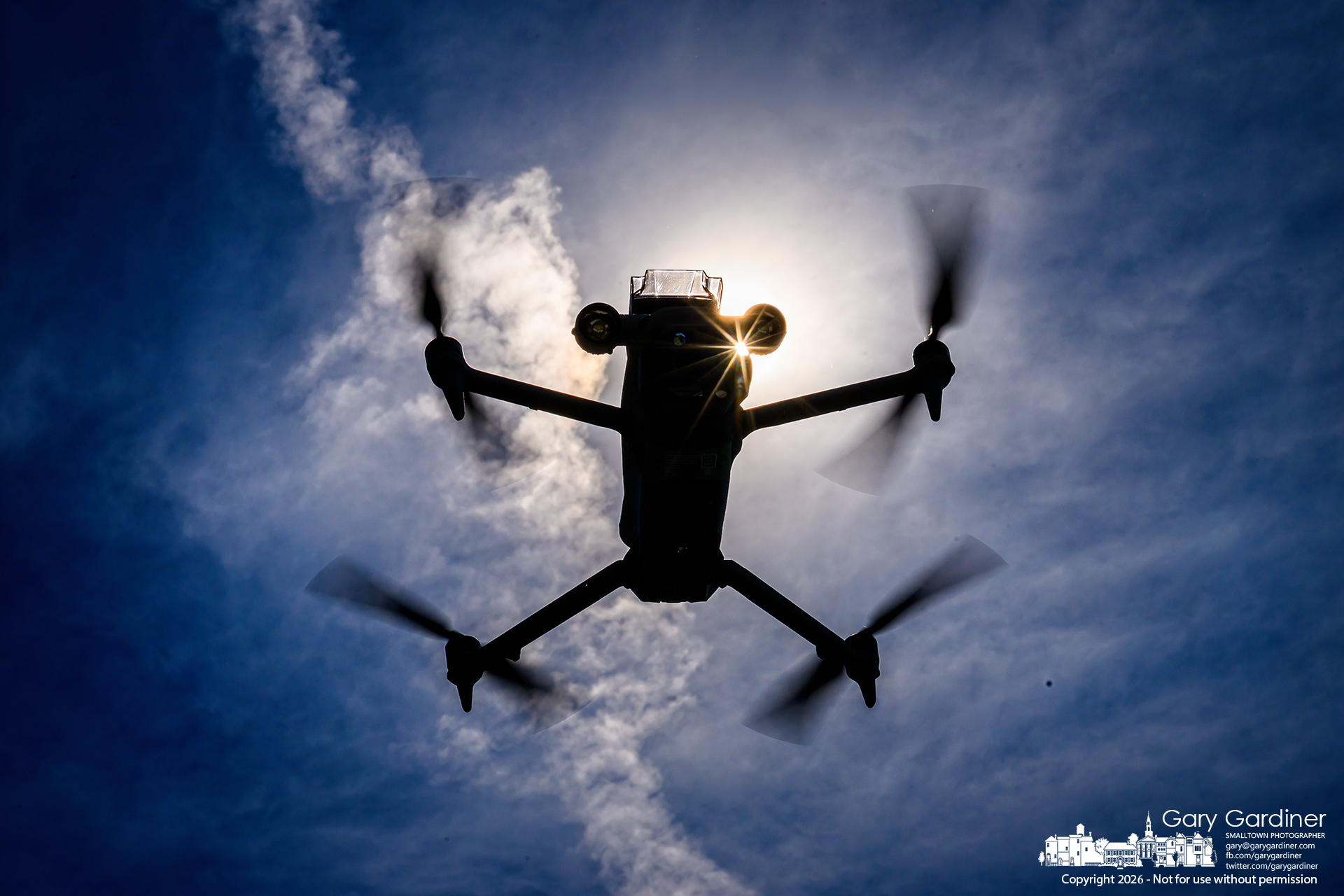 A police drone hovers over Cops and Kids D at Hoff Woods Park. (My Final Photo for June 13, 2026. Photo by Gary Gardiner)