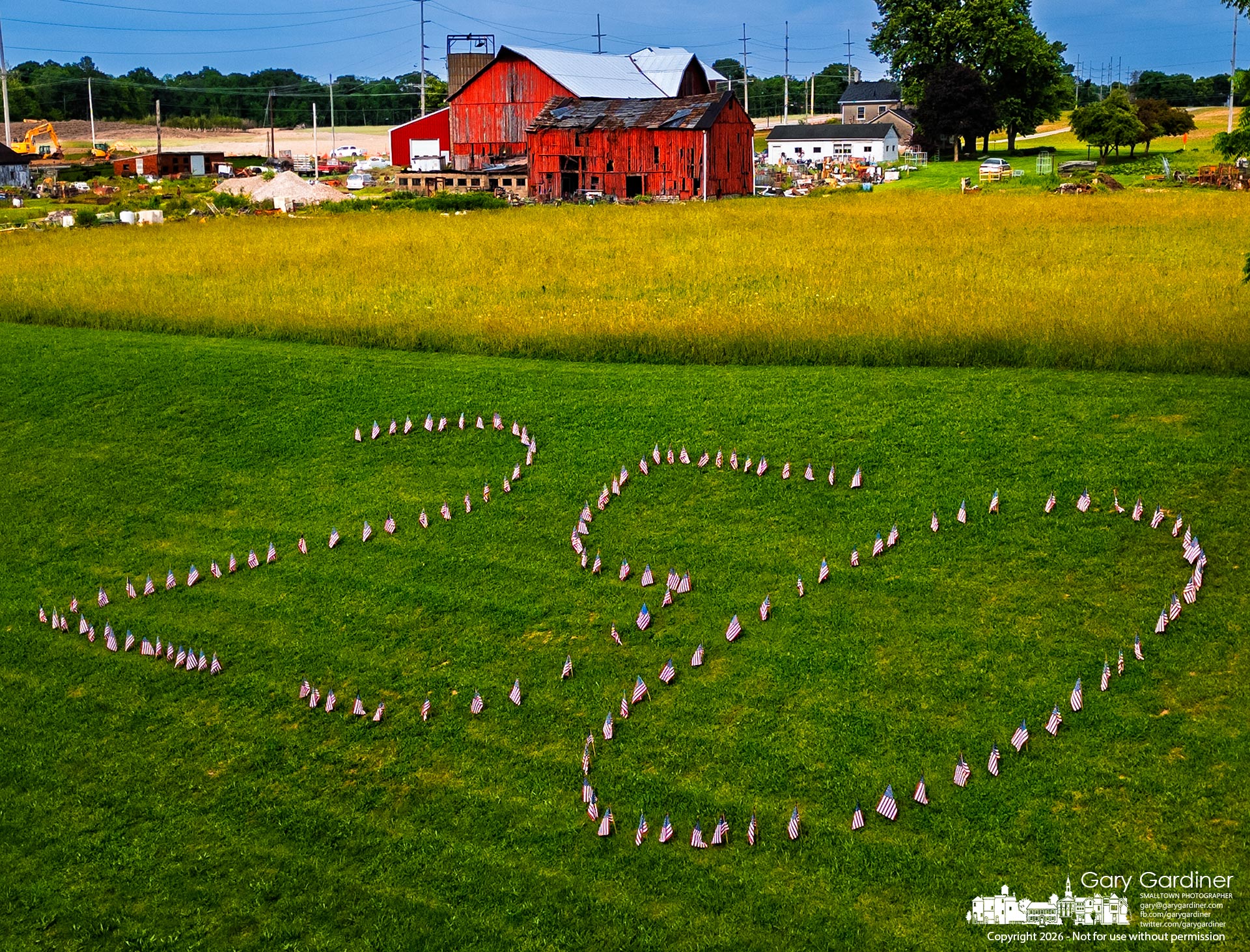 Today's 250 flags of Westerville are the 250 flags on the hill behind the hayfield at the Yarnell Farm on Africa Road. (My Final Photo for June 1, 2026)