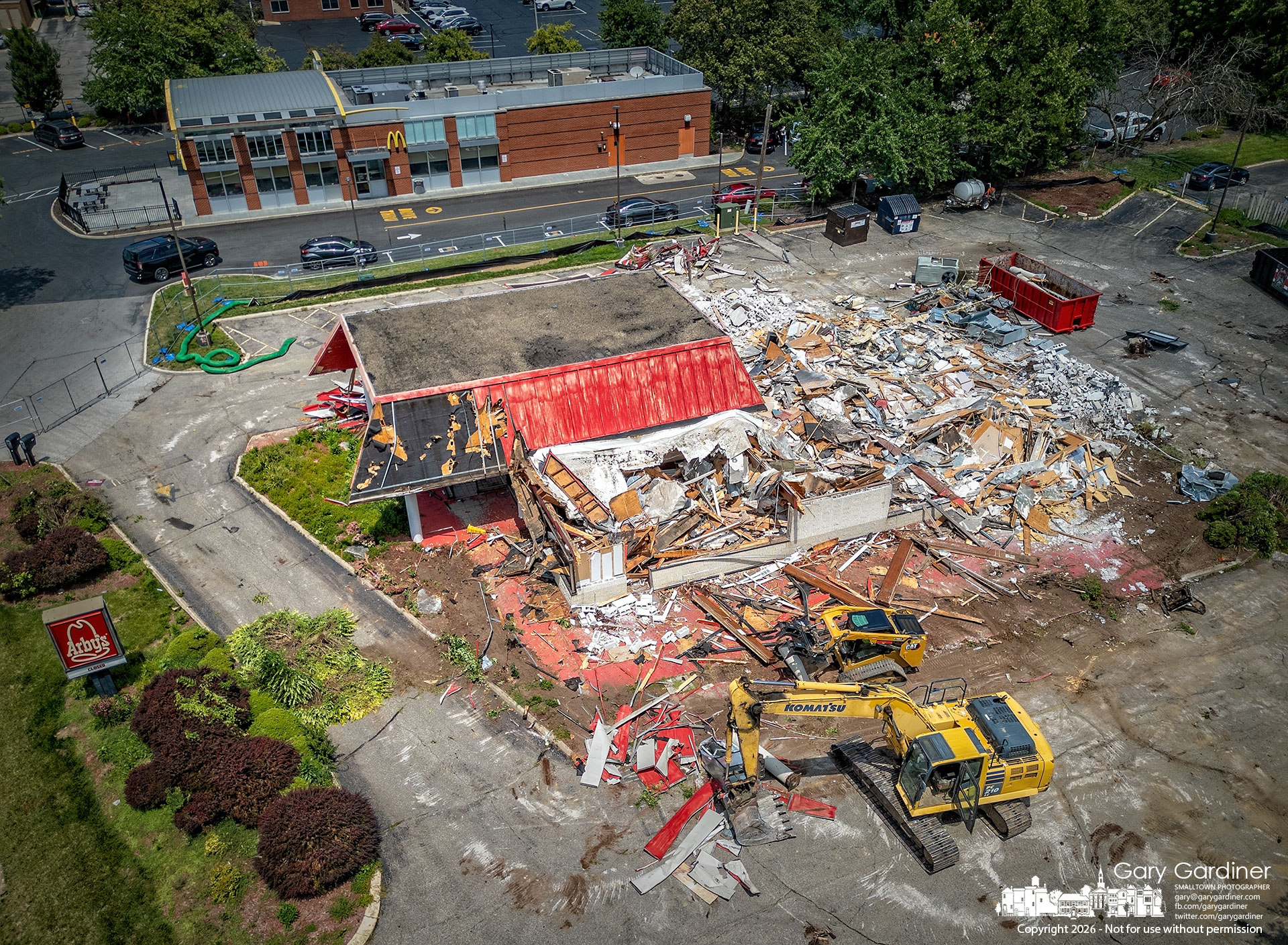 After more than a two-week delay waiting for the natural gas connection to be removed, demolition began Thursday morning on the Arby’s restaurant on South State Street. (my Final Photo for July 23, 2026. Photo by Gary Gardiner)