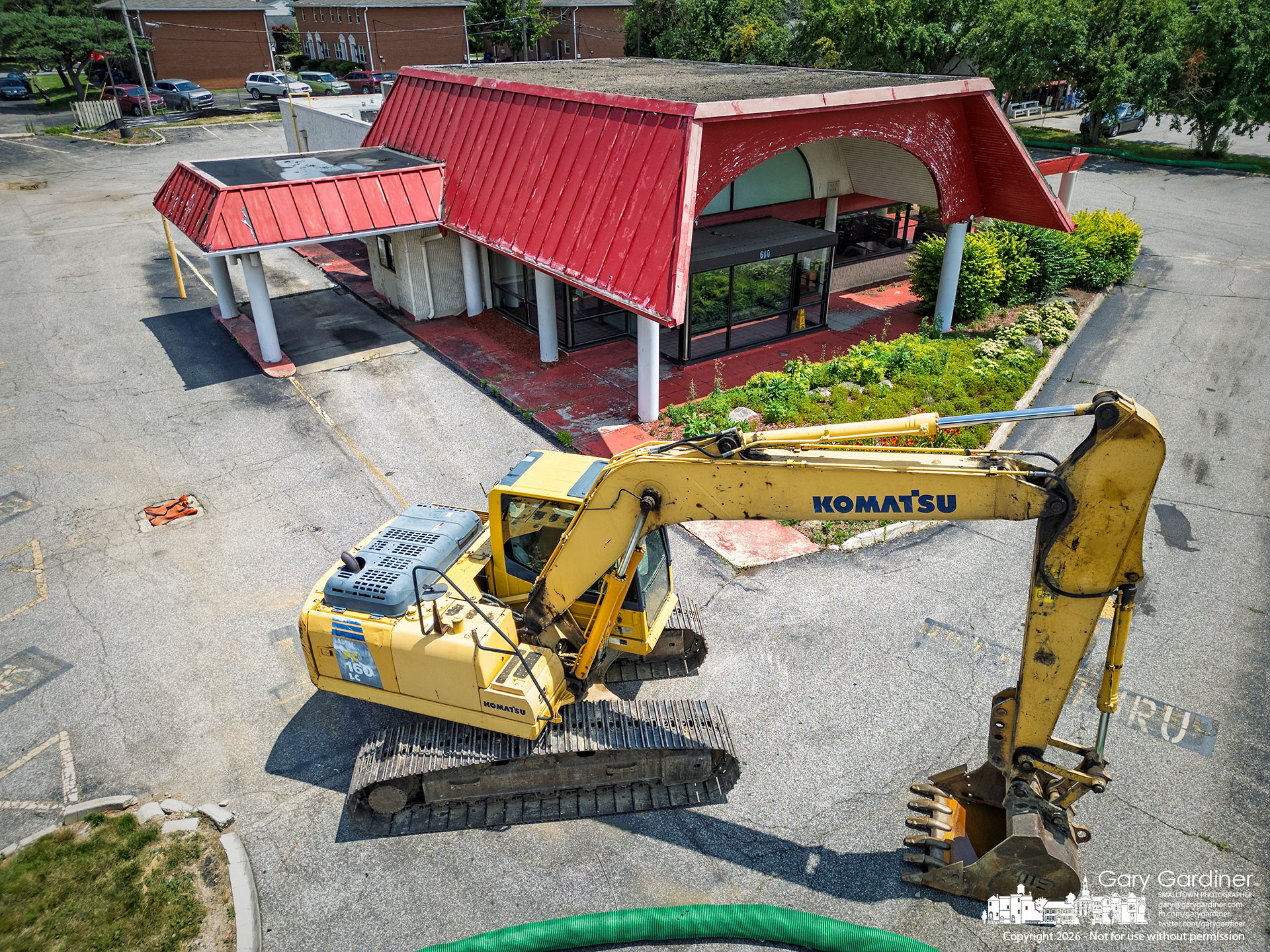 Heavy equipment blocks the entrance to the former Arby’s at 680 S. State St., where demolition is scheduled to begin at 8 a.m. Wednesday. (My Final Photo for July 6, 2026. Photo by Gary Gardiner)
