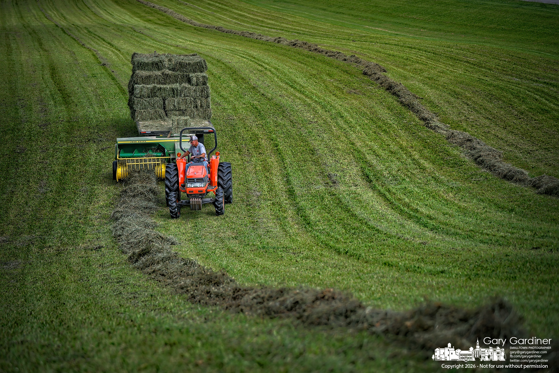 Duane Yarnewll bales the second cut of hay in his small field at County Line and Africa Roads. (My Final Photo for July 31, 2026. Photo by Gary Gardiner)