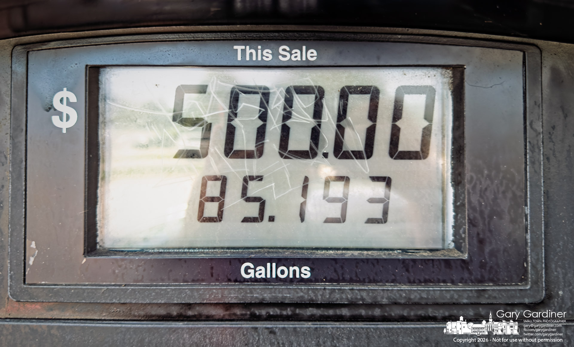 A photographer, grateful for the 12-gallon, regular-fuel, older Honda he drives, sees the previous customer's bill still on the display at the Sheetz on Westerville Road. (My Final Photo for August 21, 2026. Photo by Gary Gardiner)