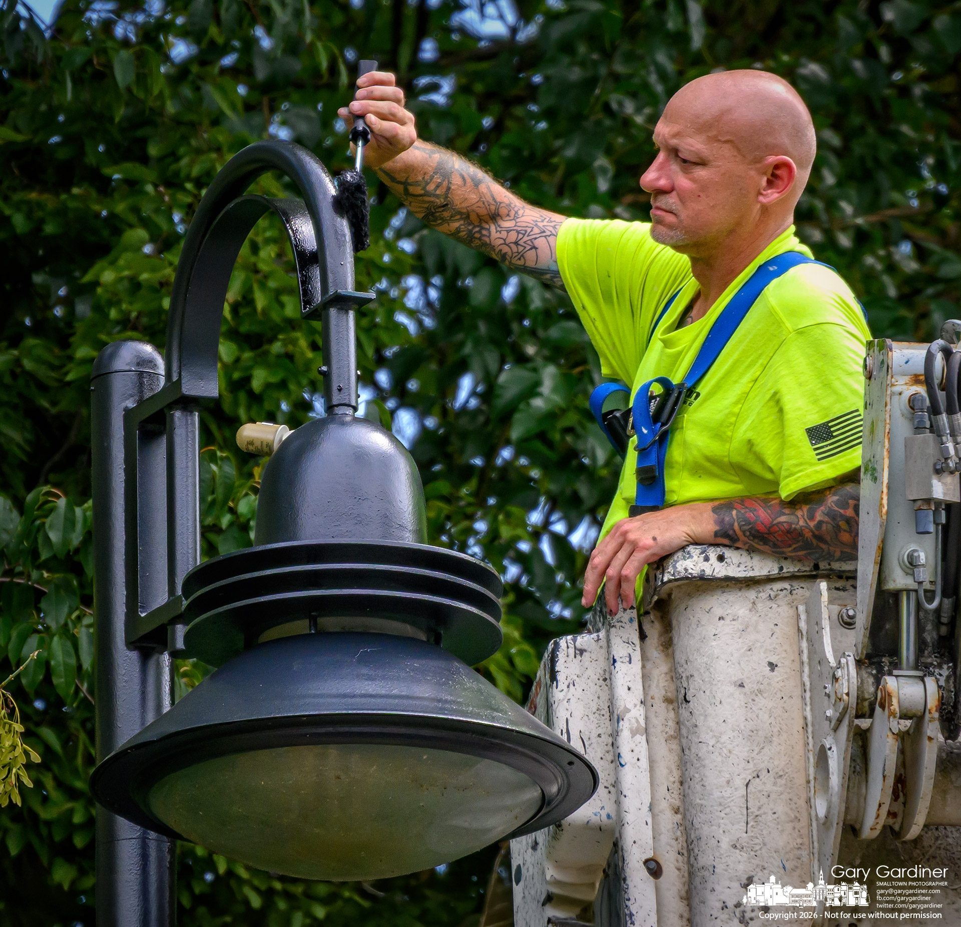 Lights along Lindimore Way at Heritage Park get a fresh coat of paint. (My Final Photo for August 31, 2026. Photo by Gary Gardiner)