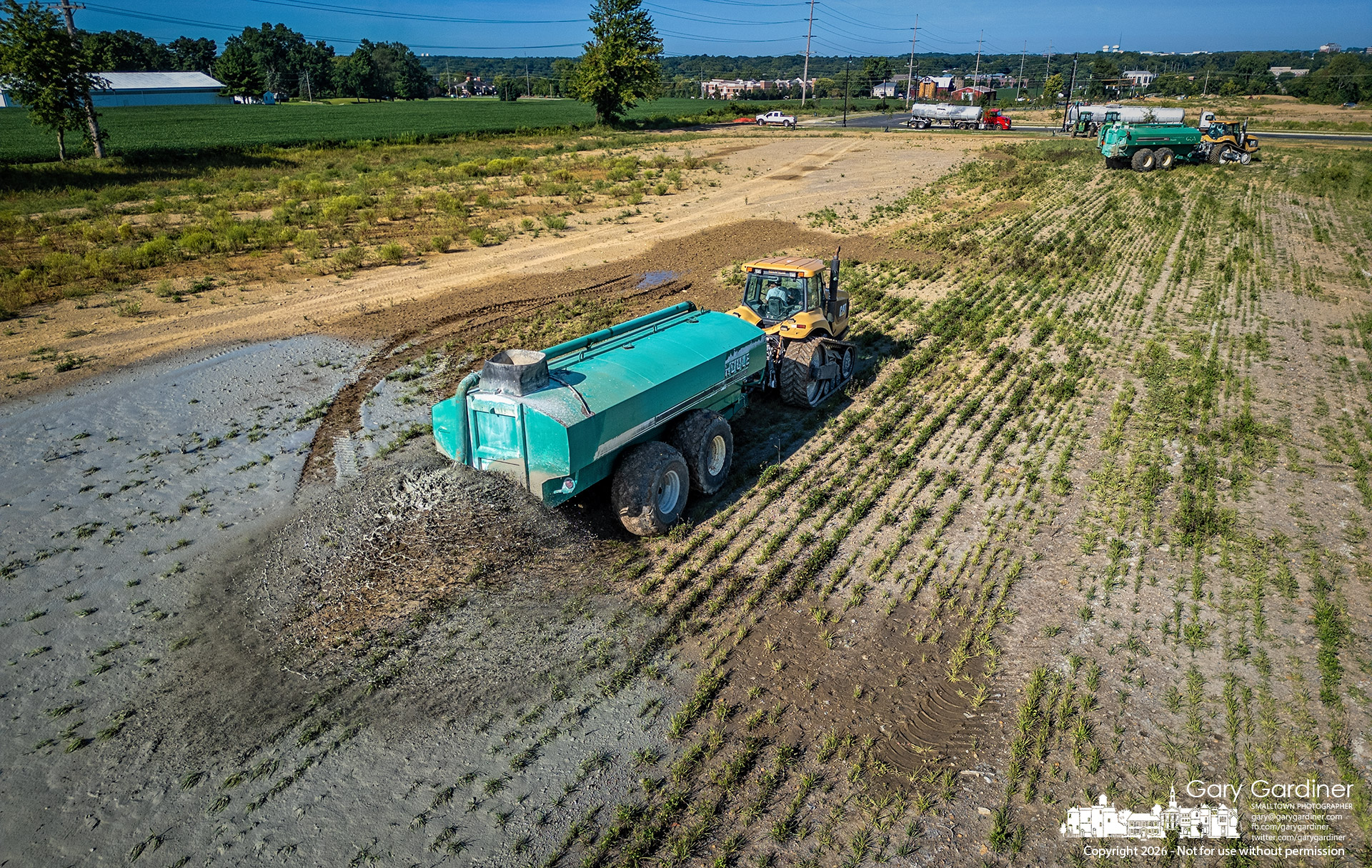 Lime used to purify the water at the city water plant is sprayed across the fields at Westar Park before the land is reseeded for crops to keep it in the agricultural tax bracket. (My Final Photo for August 25, 2026. Photo by Gary Gardiner)