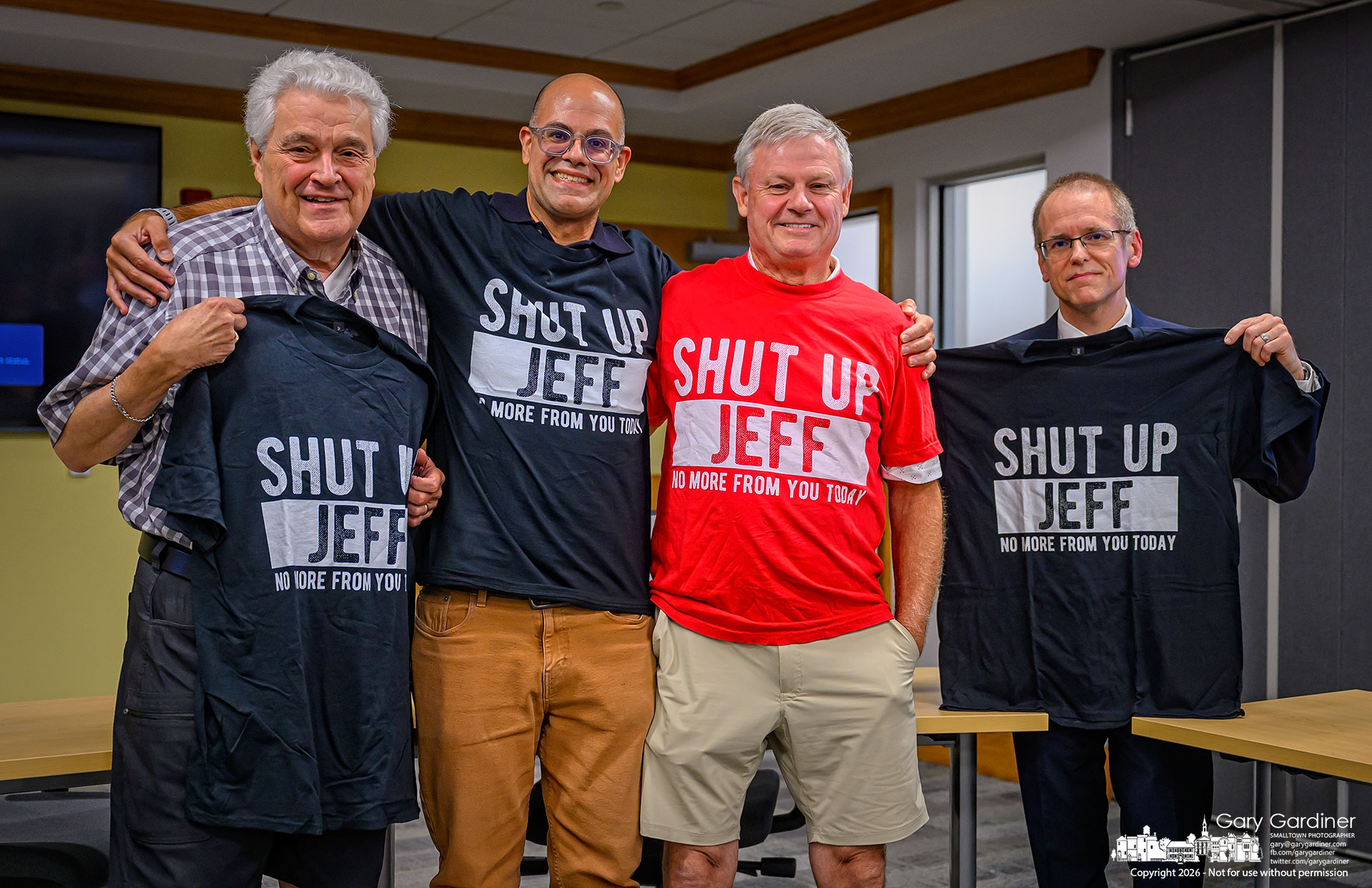 The four Jeffs associated with the Uptown Review Board show off their new club T-shirt after Thursday's meeting. From left are commission members Jeff Heckman, Jeff Pecchio, and Jeffrey Reschke. On the right is Jeff Buehler, with Westerville Planning and Zoning, moderating the meeting. (My Final Photo for September 3, 2026. Photo by Gary Gardiner)