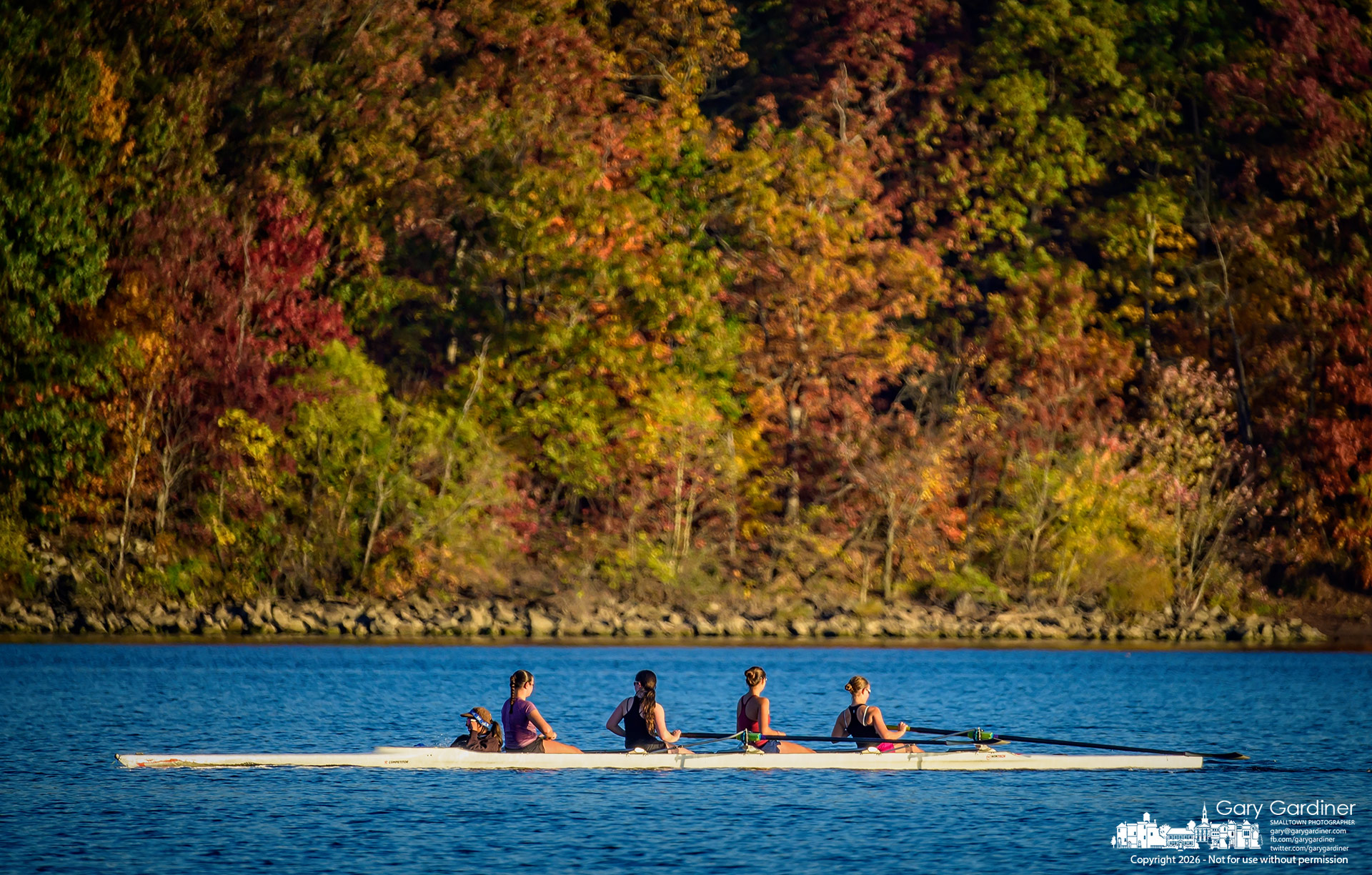 A rowing crew sits idle, waiting for other crews and the lead boat to line up during practice Wednesday afternoon on Hoover Reservoir. (My Final Photo for October 28, 2026. Photo by Gary Gardiner)