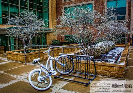 A covering of snow settled onto a bicycle parked outside an Otterbein University classroom. My Final Photo for April 15, 2015. A covering of snow settled onto a bicycle parked outside an Otterbein University classroom. My Final Photo for April 15, 2015.