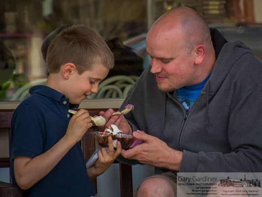 Jack Nicodemus, 7, and his father, David, enjoy a two scoop ice cream sundae on a bench in front of Graeters. My Final Photo for April 21, 2014. Jack Nicodemus, 7, and his father, David, enjoy a two scoop ice cream sundae on a bench in front of Graeters. My Final Photo for April 21, 2014.