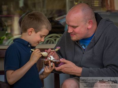Jack Nicodemus, 7, and his father, David, enjoy a two scoop ice cream sundae on a bench in front of Graeters. My Final Photo for April 21, 2014. Jack Nicodemus, 7, and his father, David, enjoy a two scoop ice cream sundae on a bench in front of Graeters. My Final Photo for April 21, 2014.