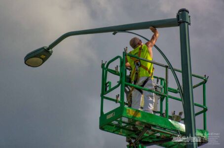 A painter removes oxidation from a light support arm on a light pole before he and the crew painted it black along Cleveland Ave. My Final Photo for Oct. 9, 2017. A painter removes oxidation from a light support arm on a light pole before he and the crew painted it black along Cleveland Ave. My Final Photo for Oct. 9, 2017.