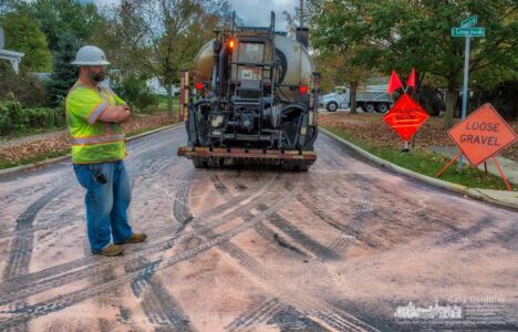 A road crew finishes applying pink sealant to Summit Street before placing a layer of finish gravel on the street in Uptown Westerville. My Final Photo for Oct. 11, 2017. A road crew finishes applying pink sealant to Summit Street before placing a layer of finish gravel on the street in Uptown Westerville. My Final Photo for Oct. 11, 2017.