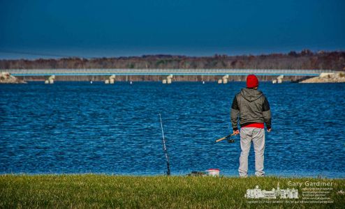 A fisherman who appears to rather be fishing than shopping on Black Friday surveys the condition of one of his poles along the shore of Hoover Reservoir near the Walnut Street boat ramp. My Final Photo for Nov. 24, 2017. A fisherman who appears to rather be fishing than shopping on Black Friday surveys the condition of one of his poles along the shore of Hoover Reservoir near the Walnut Street boat ramp. My Final Photo for Nov. 24, 2017.