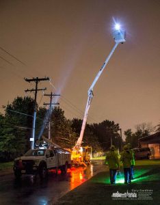 A city electric crew member in a bucket truck raised to its highest point studies the electric power lines as a circuit is turned back on following an outage during heavy rain storm. My Final Photo for Nov. 1, 2017. A city electric crew member in a bucket truck raised to its highest point studies the electric power lines as a circuit is turned back on following an outage during heavy rain storm. My Final Photo for Nov. 1, 2017.