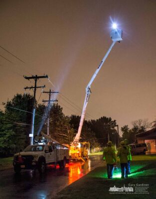 A city electric crew member in a bucket truck raised to its highest point studies the electric power lines as a circuit is turned back on following an outage during heavy rain storm. My Final Photo for Nov. 1, 2017. A city electric crew member in a bucket truck raised to its highest point studies the electric power lines as a circuit is turned back on following an outage during heavy rain storm. My Final Photo for Nov. 1, 2017.