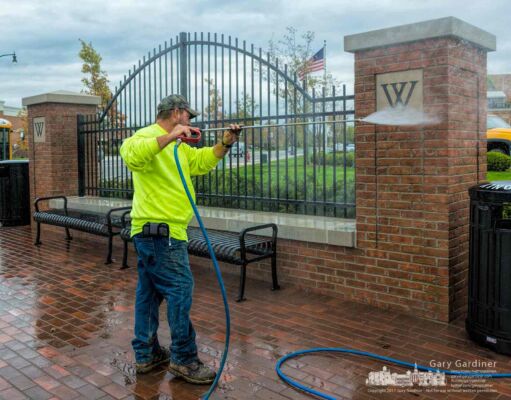 A technician uses a high-pressure washer to clean one of the corner structures at State and Schrock. My Final Photo for Nov. 2, 2017. A technician uses a high-pressure washer to clean one of the corner structures at State and Schrock. My Final Photo for Nov. 2, 2017.