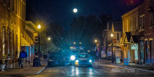 A full moon rises behind traffic on East College on a Friday night in Uptown Westerville. My Final Photo for Nov. 3, 2017. A full moon rises behind traffic on East College on a Friday night in Uptown Westerville. My Final Photo for Nov. 3, 2017.