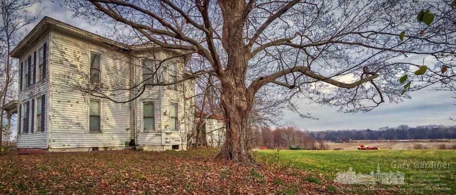 The old farmhouse on the BraunFarm sits beside a maple tree along Cleveland Ave. with a senior housing project being built on the opposite end of the property along Cooper Road. My Final Photo for Dec. 11, 2017. The old farmhouse on the Braun Farm sits beside a maple tree along Cleveland Ave. with a senior housing project being built on the opposite end of the property along Cooper Road. My Final Photo for Dec. 11, 2017.
