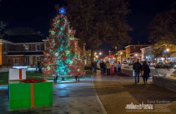 The last of the crowd leaves the new courtyard in front of city hall after the holiday tree lighting ceremony. My Final Photo for Dec. 1, 2017. The last of the crowd leaves the new courtyard in front of city hall after the holiday tree lighting ceremony. My Final Photo for Dec. 1, 2017.