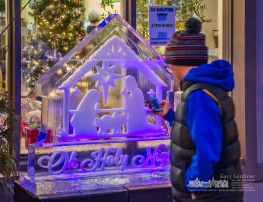 Nine-year-old Hayden uses a remote control to turn on lights beneath one of the ice sculptures installed on the sidewalk in Uptown Westerville Friday afternoon. My Final Photo for Dec. 15, 2017. Nine-year-old Hayden uses a remote control to turn on lights beneath one of the ice sculptures installed on the sidewalk in Uptown Westerville Friday afternoon. My Final Photo for Dec. 15, 2017.