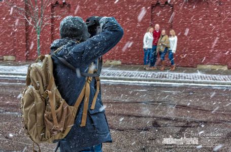 A photographer poses a family along East College for a portrait during the first major snow of the season Saturday afternoon in Uptown Westerville. My Final Photo for Dec. 9, 2017. A photographer poses a family along East College for a portrait during the first major snow of the season Saturday afternoon in Uptown Westerville. My Final Photo for Dec. 9, 2017.