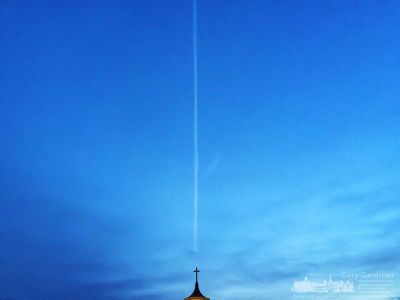 An early morning flight creates a contrail behind the cross atop the old steeple for St. Paul the Apostle Catholic Church in Westerville. My Final Photo for Dec. 17, 2017. An early morning flight creates a contrail behind the cross atop the old steeple for St. Paul the Apostle Catholic Church in Westerville. My Final Photo for Dec. 17, 2017.